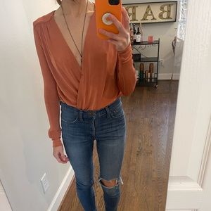 ⭐️ moving sale! ⭐️ free people turnt bodysuit